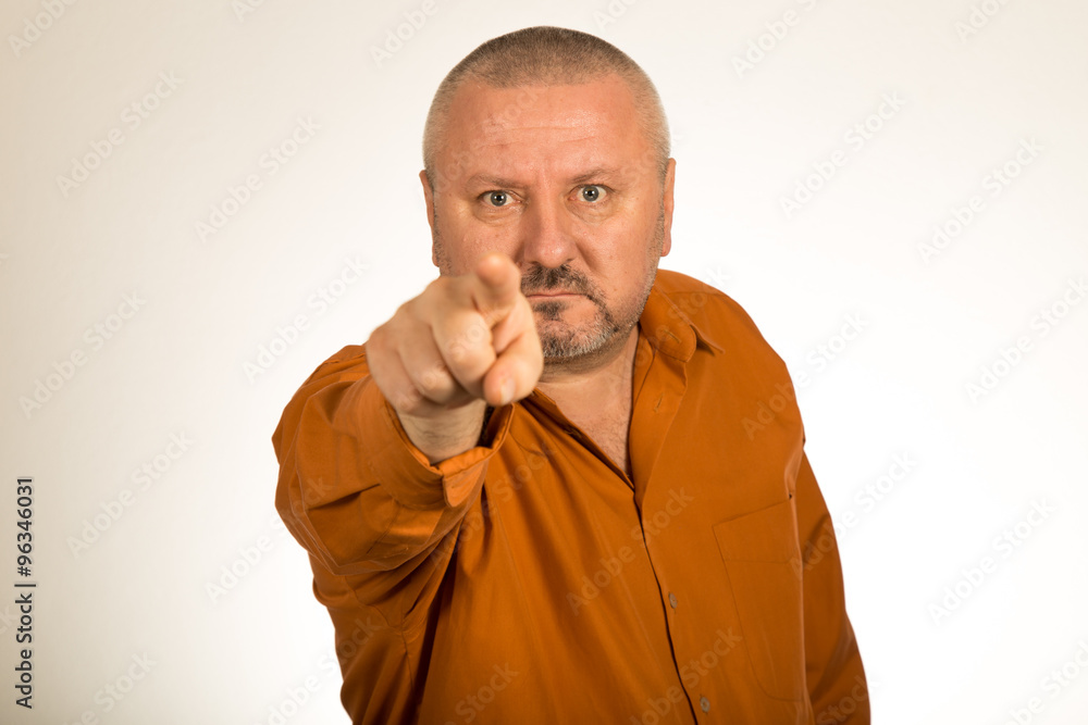 An angry man with beard pointing finger at you An angry man with beard pointing finger at you