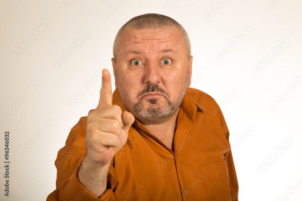 An angry man with beard pointing finger at you An angry man with beard pointing finger at you
