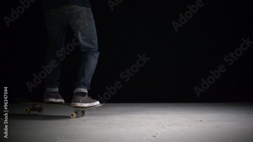 Skater rolling into kickflip trick shooting with high speed camera, phantom flex.