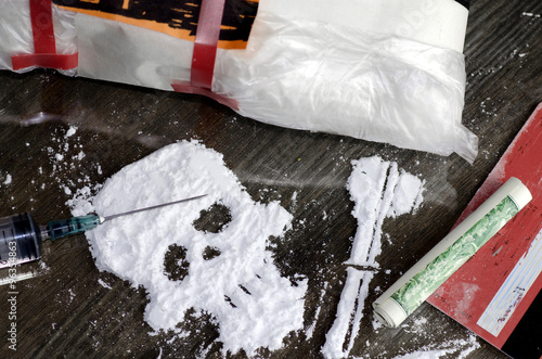 Drug powder cocaine in the silhouette of the skull