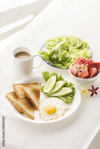 breakfast with egg toast fruit and vegetable salad