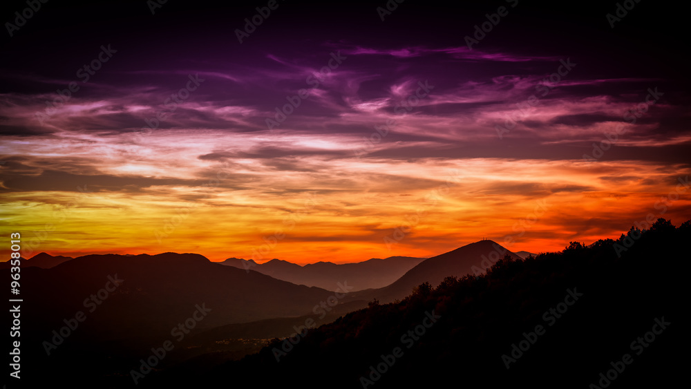 distant layered mountains at sunset distant layered mountains at sunset