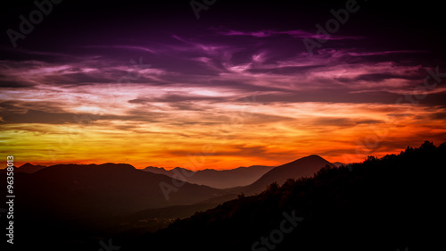 distant layered mountains at sunset