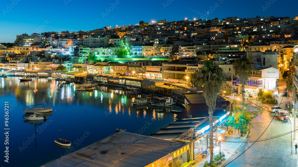 Mikrolimano port in Peraeus Greece against the city lights.