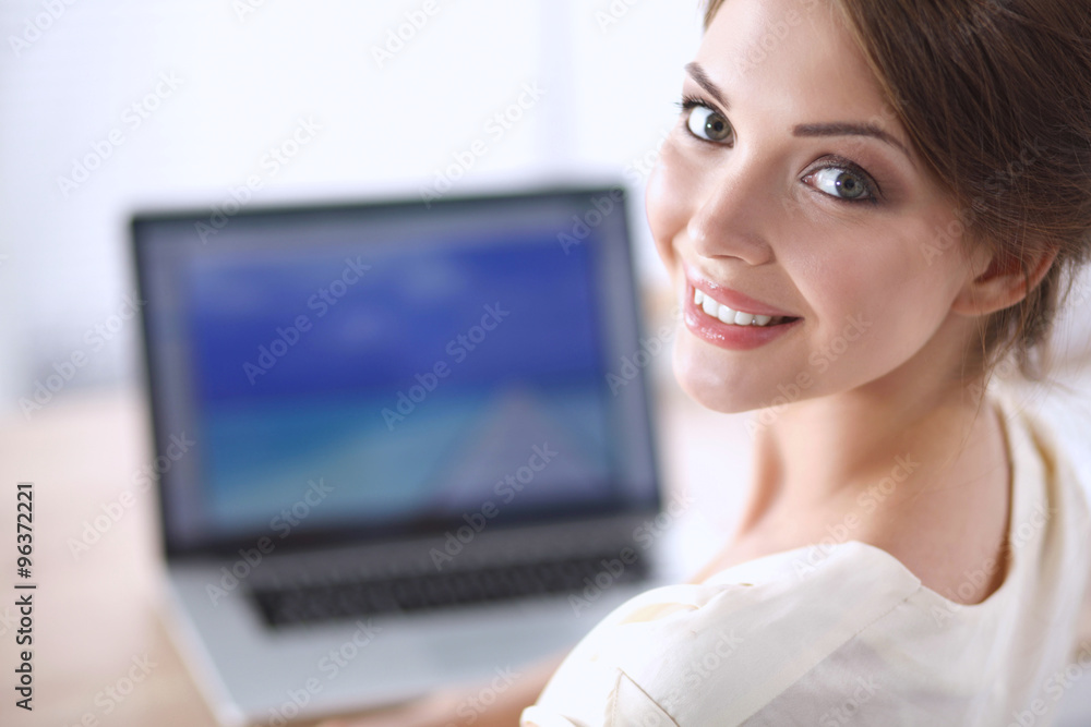 Portrait of beautiful young business woman working on a laptop Portrait of beautiful young business woman working on a laptop