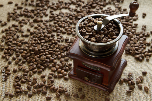Coffee grinder on a background coffee beans