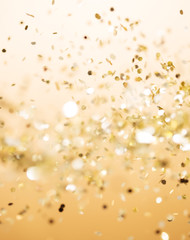 Christmas gold background. Golden holiday glowing abstract glitt