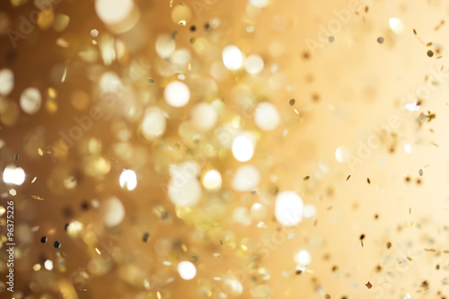 Christmas gold background. Golden holiday glowing abstract glitt