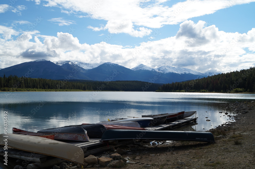 Canoes on the edge of a lake in Jasper National Park.