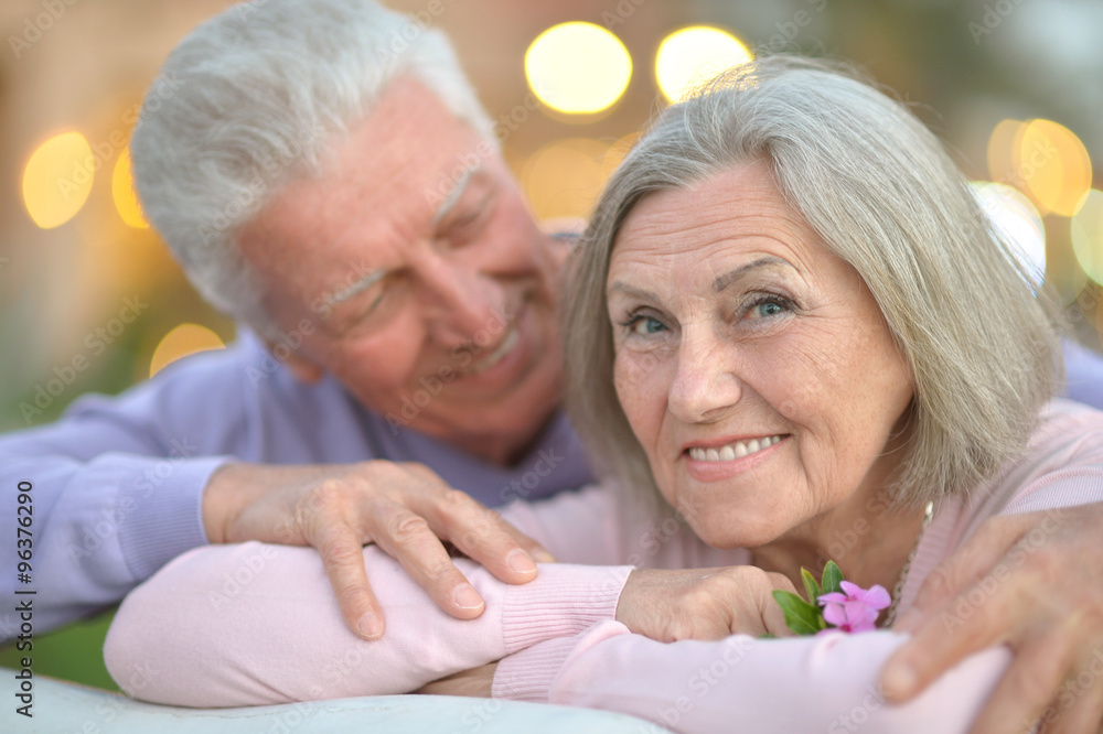 smiling old couple with flower smiling old couple with flower