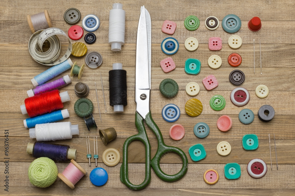 full sewing kit on wooden backgrounds full sewing kit on wooden backgrounds
