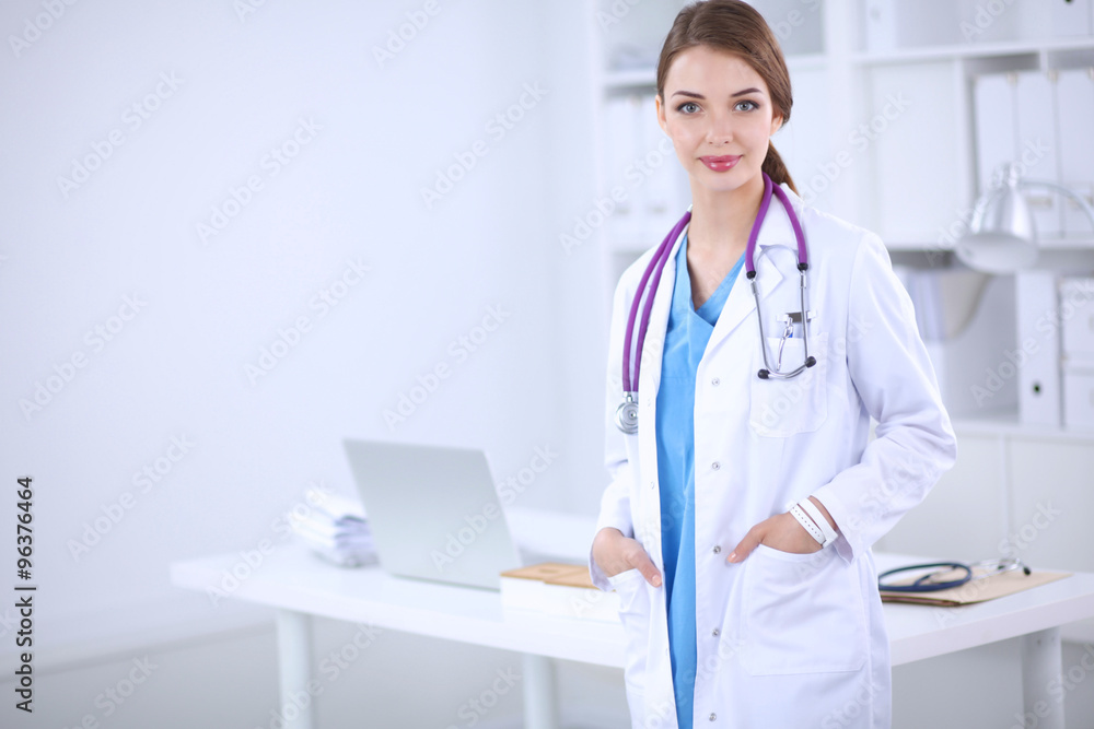 © lenets_tan - Portrait of young woman doctor with white coat standing in hosp