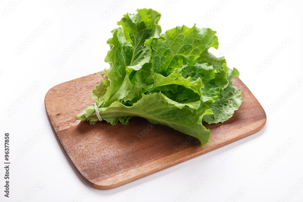 Bunch of Salad Leaves on Wooden Cutting Board