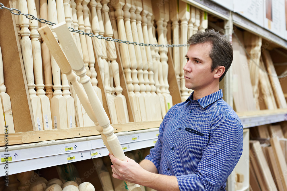 Man shopping for baluster timber in shop Man shopping for baluster timber in shop