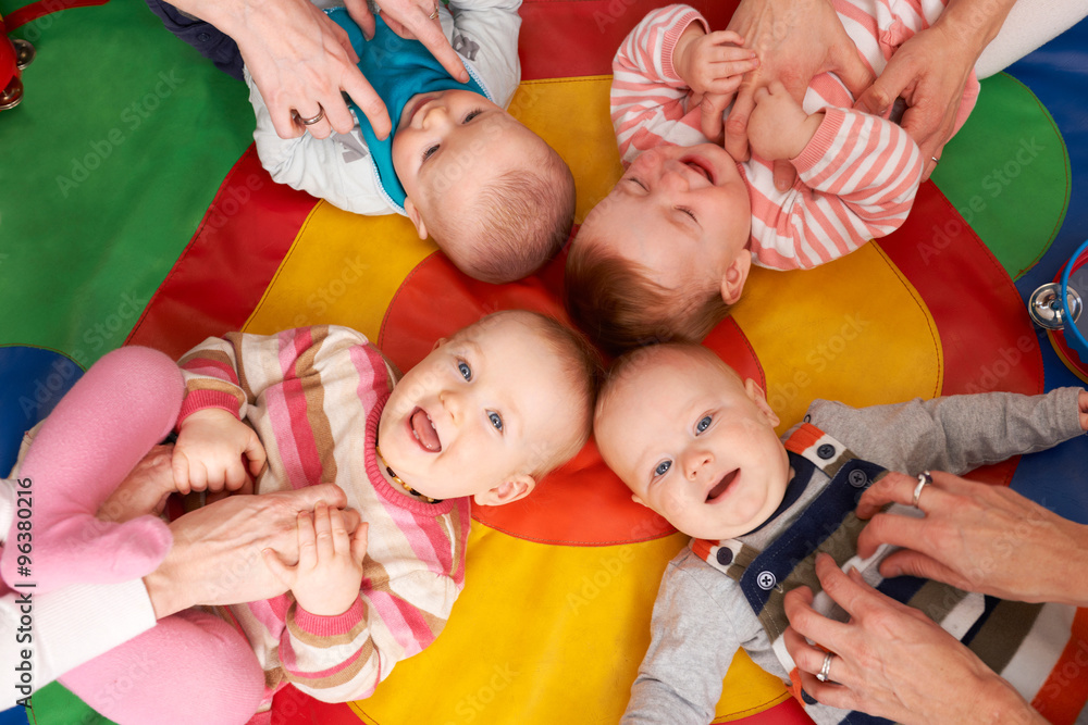 Overhead View Of Babies Having Fun At Nursery Playgroup - obrazy, fototapety, plakaty 