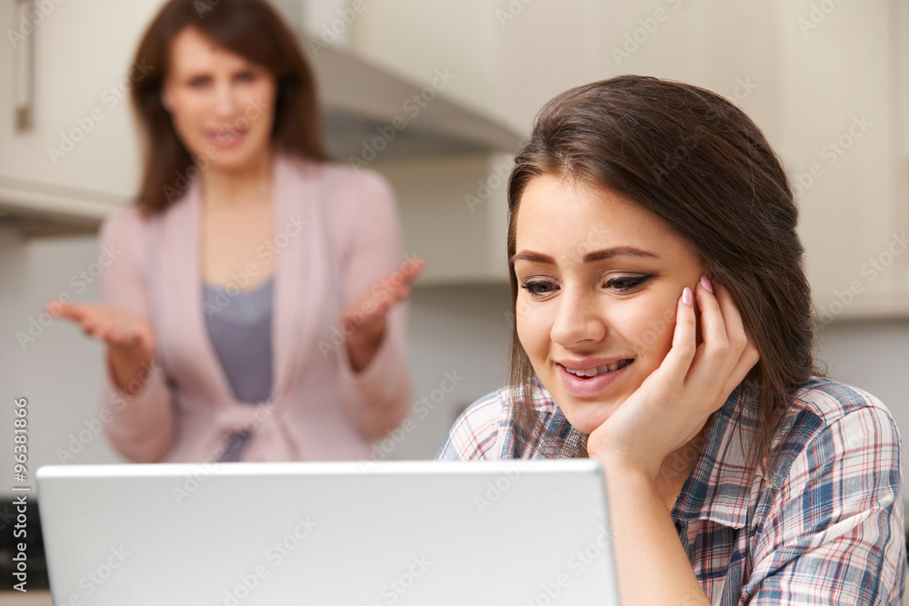 Mother Arguing With Teenage Daughter Over Online Activity Mother Arguing With Teenage Daughter Over Online Activity