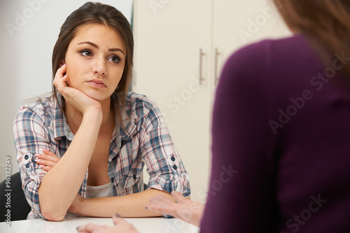 Teenage Girl Suffering From Depression Visiting Counsellor