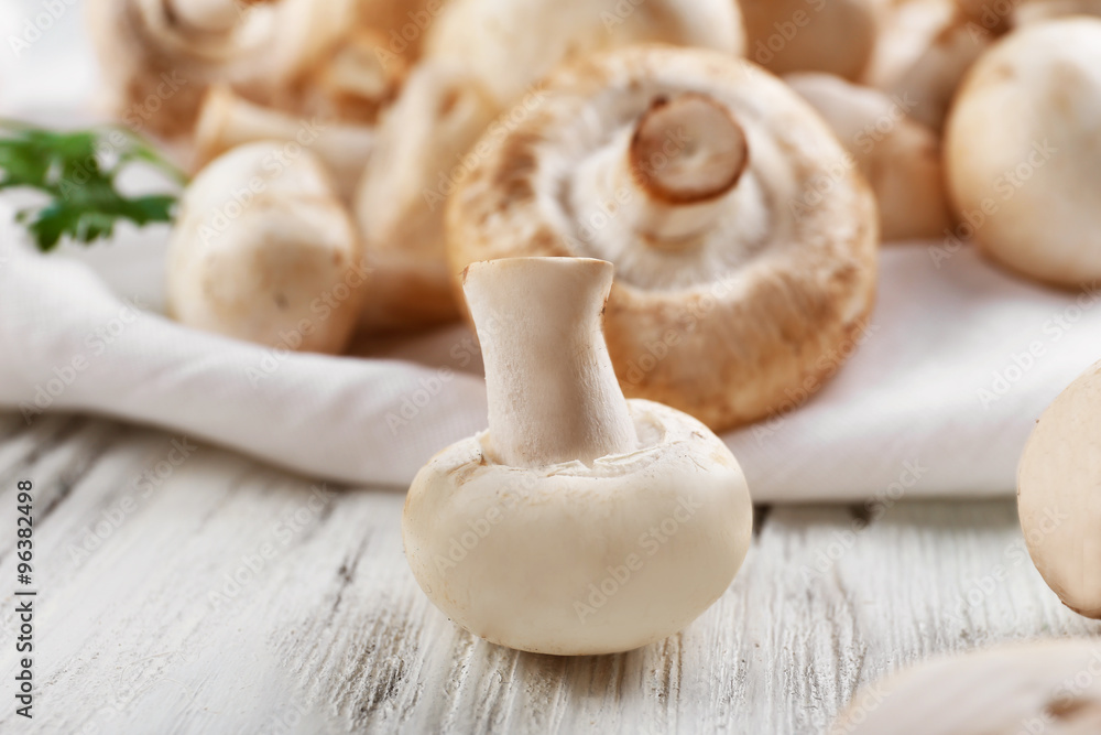Champignon mushrooms on white wooden background Champignon mushrooms on white wooden background