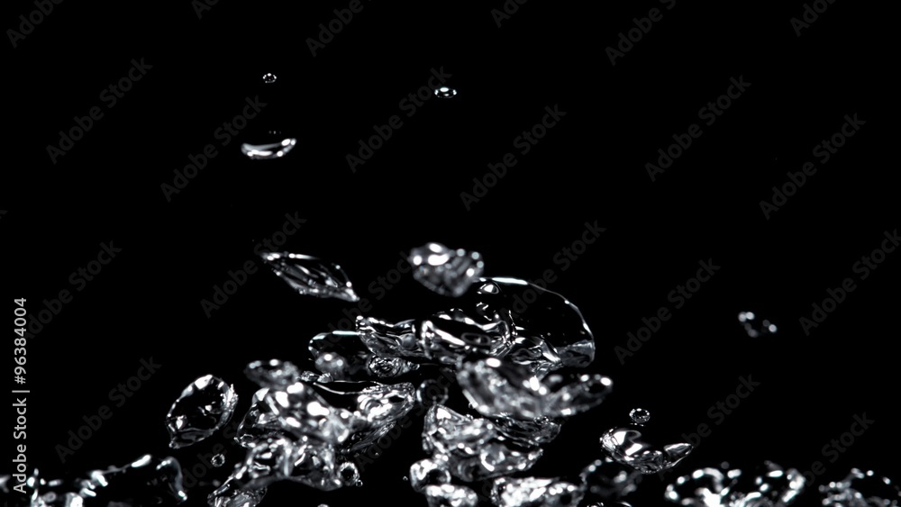 Water bubbles rising against black background. Shot with high speed camera, phantom flex 4K. Slow Motion. Water bubbles rising against black background. Shot with high speed camera, phantom flex 4K. Slow Motion.