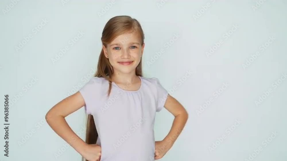 Thumbs up. Ok. Girl is on the white background. Laughing child Thumbs up. Ok. Girl is on the white background. Laughing child