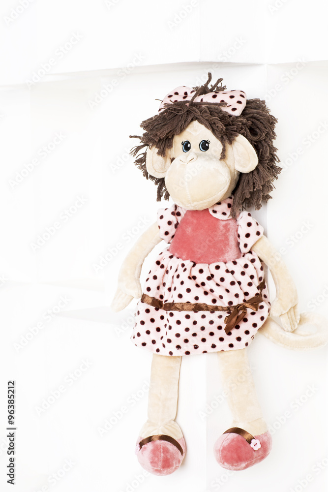 Soft toy monkey on a white background. Soft toy monkey on a white background.