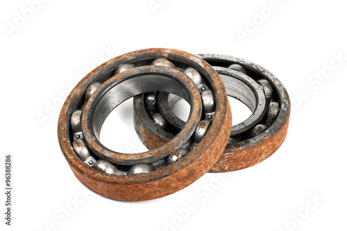 Old and rusty ball bearing, isolated on white background