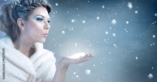 Winter woman  blowing snow - snow queen photo