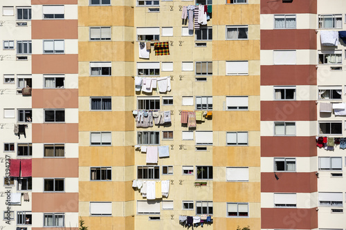 an apartment building with clothes drying outdoors