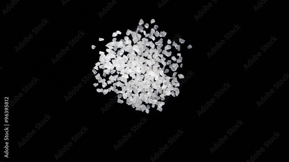 Salt Exploding Sea salt exploding against black background. Shot with high speed ...