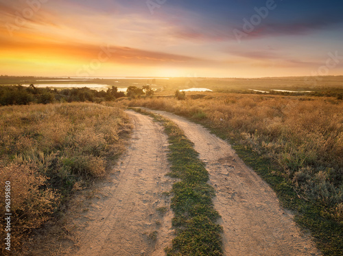 Rural road on the mountain hill. Beautiful natural landscape