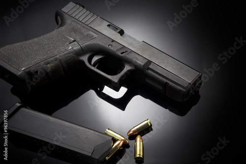 Pistol gun on black background