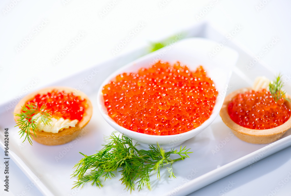 Tartlets with red caviar closeup. Gourmet food Tartlets with red caviar closeup. Gourmet food