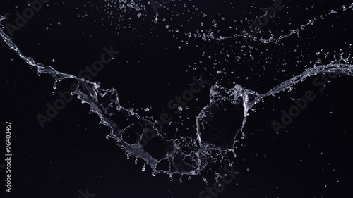 Water splash in midair against black background. Shot with high speed camera, phantom flex 4K. Slow Motion. Unedited version is included at the end of clip.