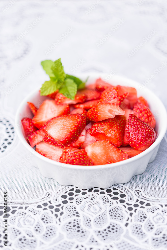 Aerial view fresh aromatic red strawberries cutted in thin slices Aerial view fresh aromatic red strawberries cutted in thin slices