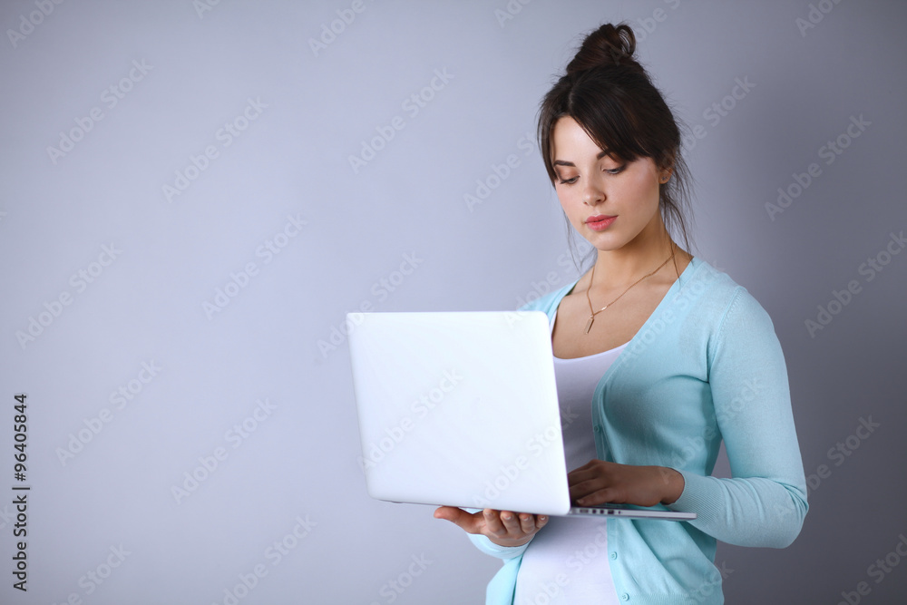 Happy young woman using her laptop Happy young woman using her laptop