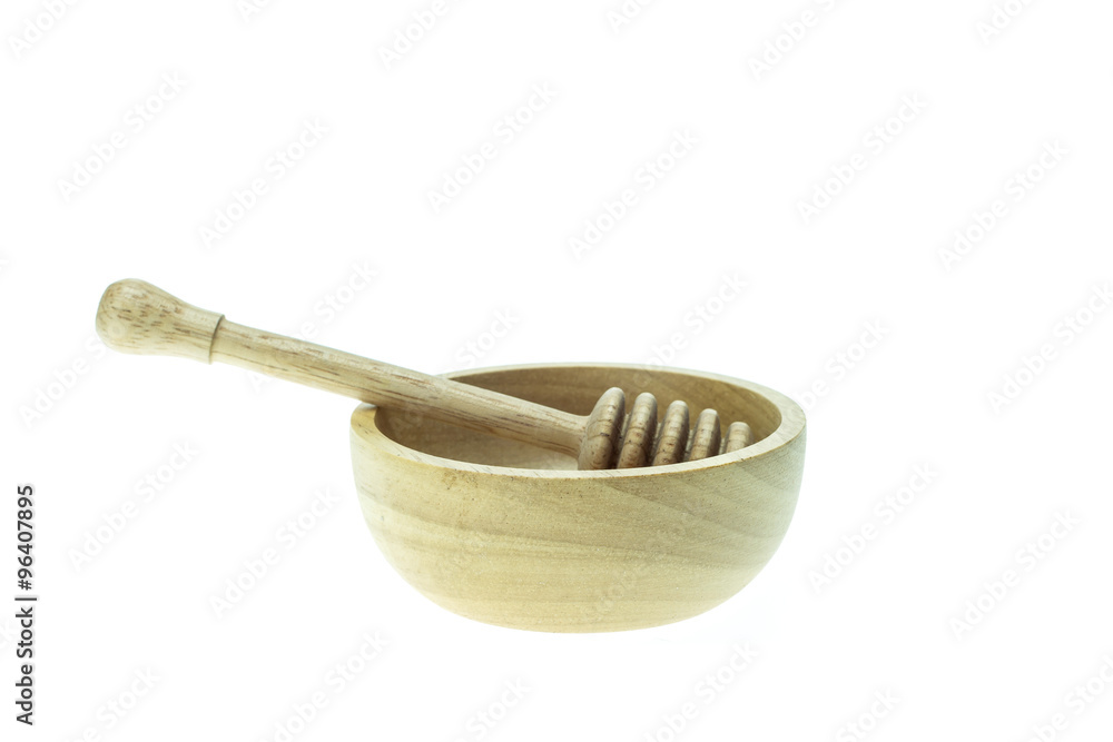 Wooden honey drizzler and bowl isolated on white background Wooden honey drizzler and bowl isolated on white background