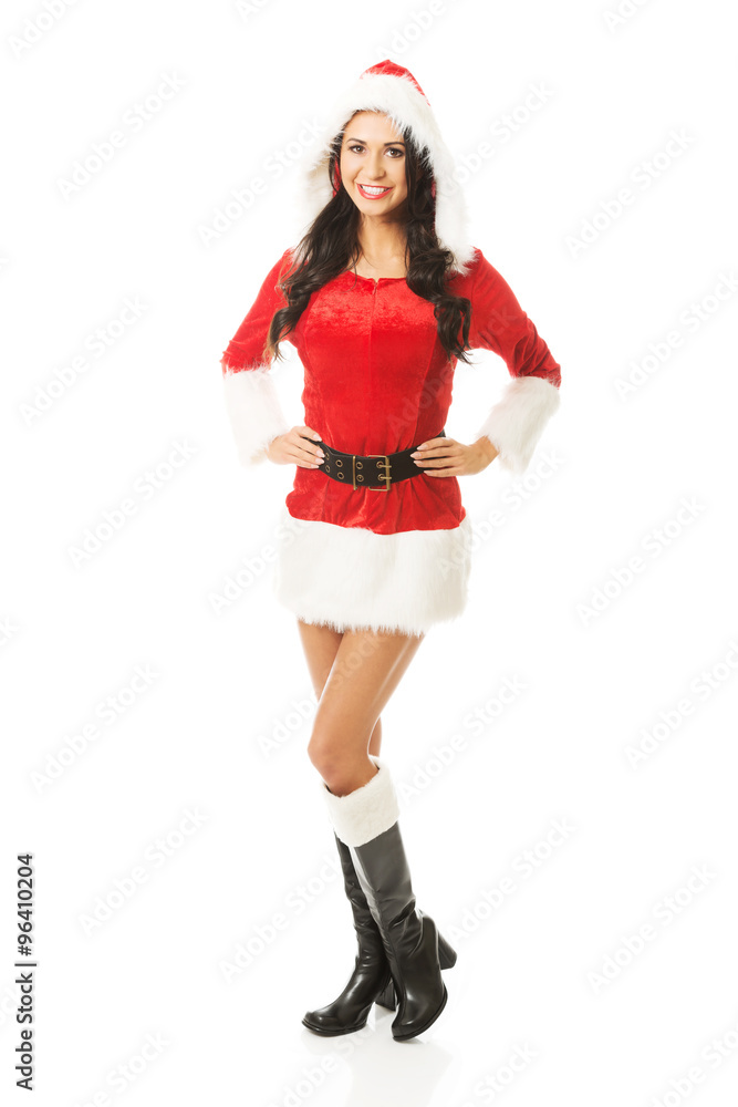 Back view of santa woman standing with hands on hips, looking at the camera Back view of santa woman standing with hands on hips, looking at the camera