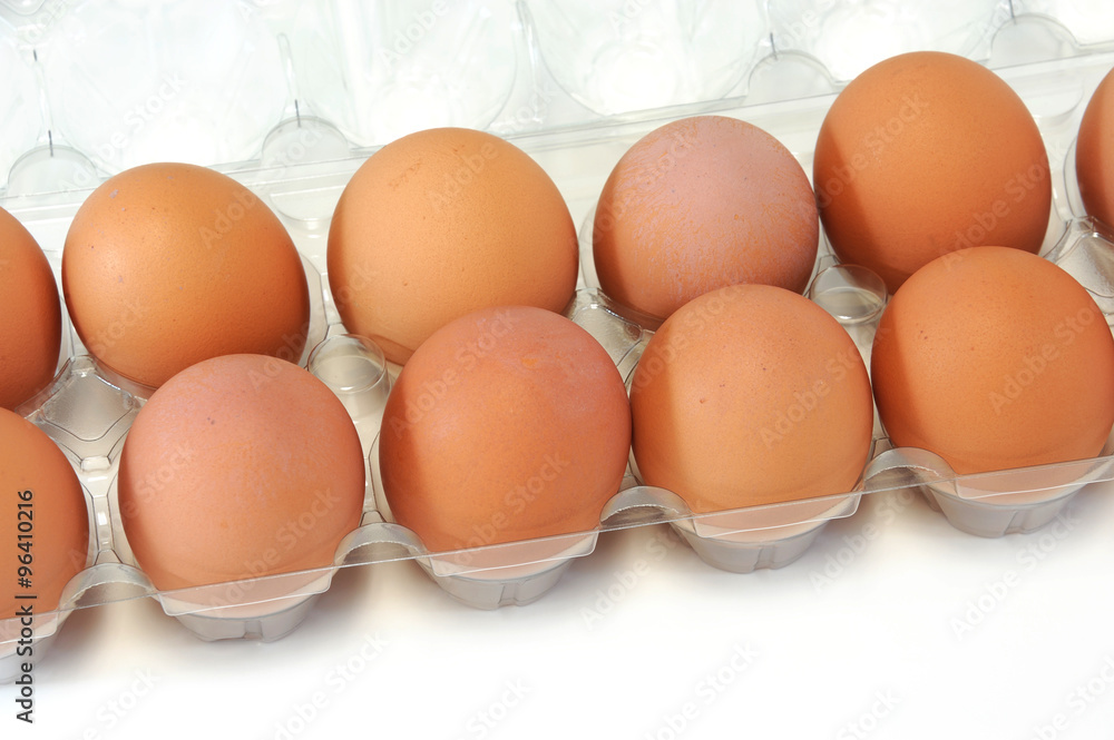 close-up on fresh egg on white background close-up on fresh egg on white background