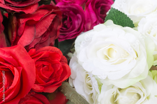 Colourful artificial flower made from plastic and fabric.