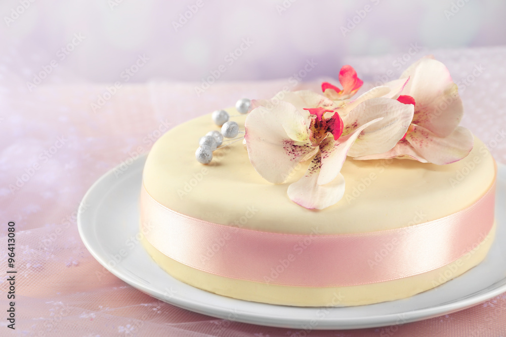 Cake with sugar paste flowers, on light background Cake with sugar paste flowers, on light background