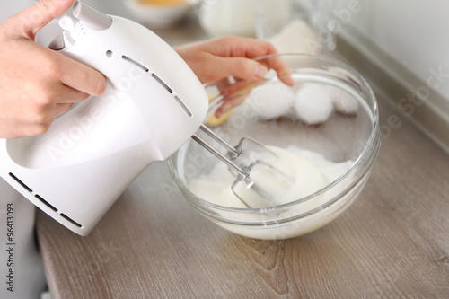 Cooking buttery cream on kitchen