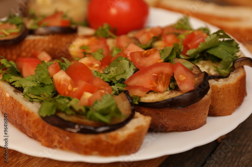 Bruschetta with grilled eggplant and vegetables on ciabatta