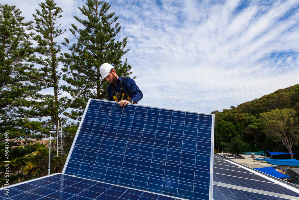 Solar panel technician installing solar panels Solar panel technician installing solar panels