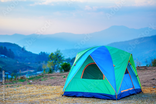 tent in the twilight overlooking mountains and a valley © jaboo_foto