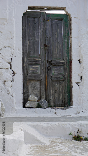 door in small greece village exo gonia on santorini photo