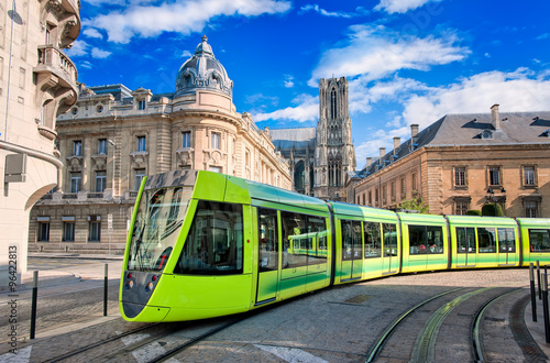 Modern tram on the streets of the old town of Reims, France photo