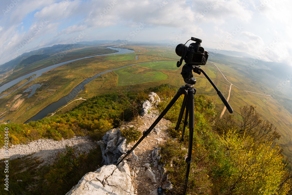 Camera is on a tripod on top of the mountain, fisheye lens
