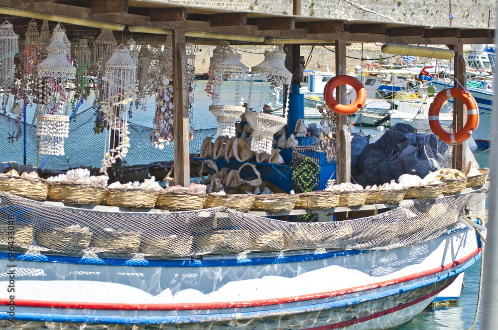 Souvenir boat in Greek harbor