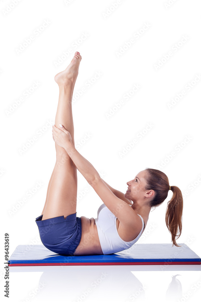 Young beautiful fitness girl doing exercise isolated on white Young beautiful fitness girl doing exercise isolated on white