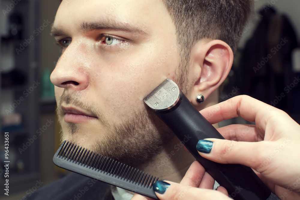 men's haircut in the salon barbershop beard closeup men's haircut in the salon barbershop beard closeup